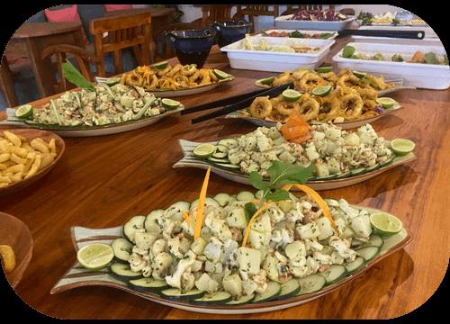 Plates of fresh seafood salad with octopus, calamari and lime at Helio Capitano