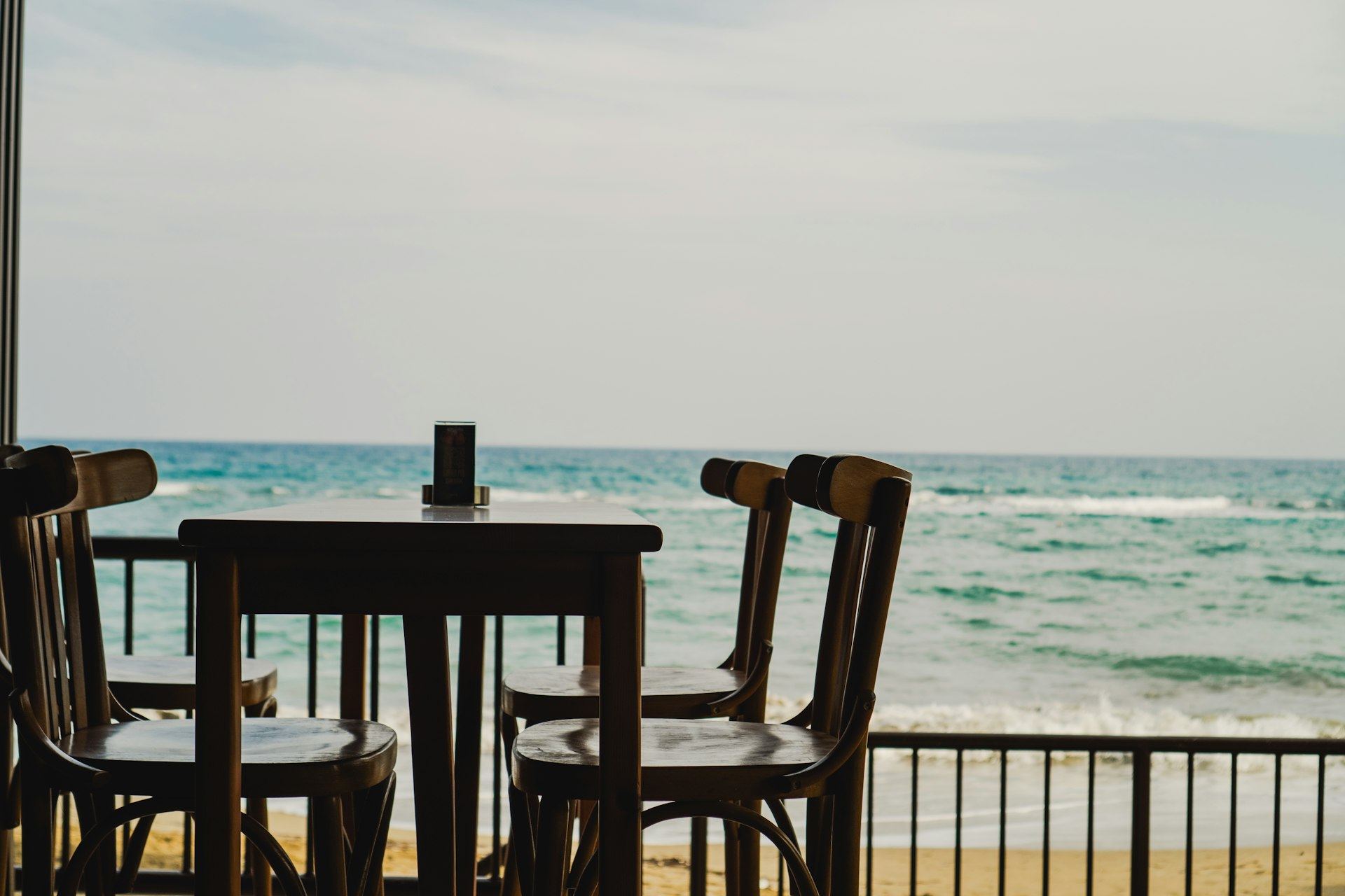 Beachfront restaurant terrace at Helio Capitano looking out over the turquoise Indian Ocean at Paje